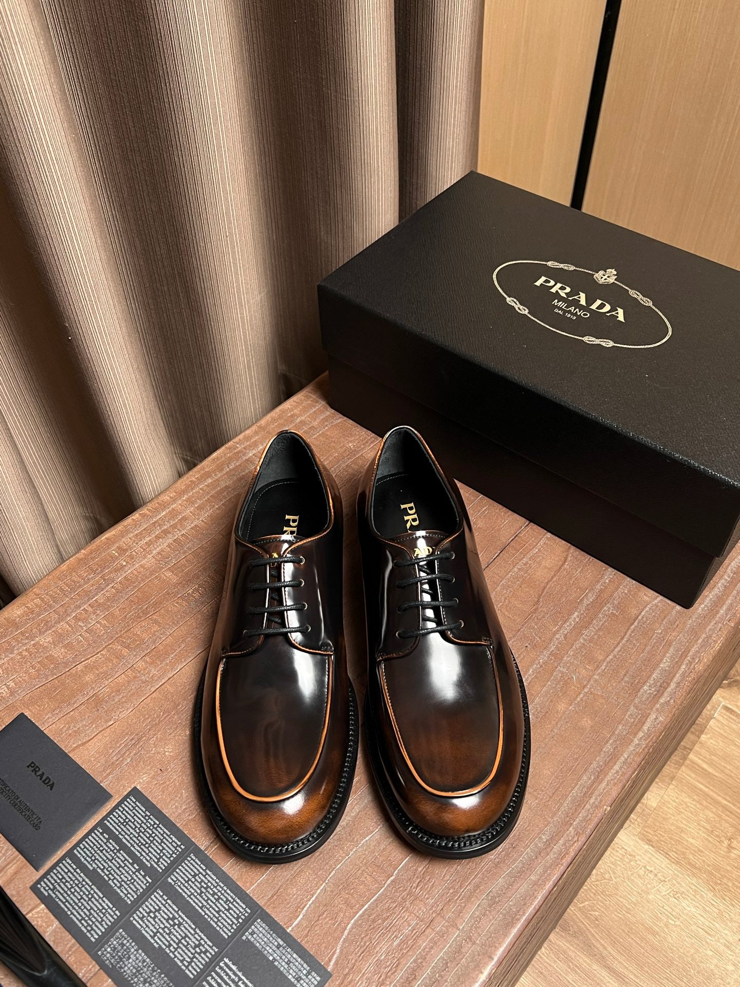 Prada lace-up leather shoes, dark brown with tan welt and black laces
