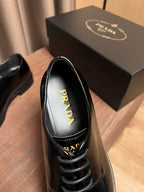 Prada unisex black leather lace-up oxfords, insole view with Prada print