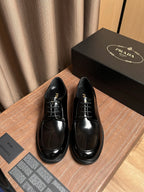 Prada black leather lace-up shoes with glossy finish and round toe