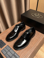 Prada black leather lace-up shoes, front views with lace-up vamp and shine