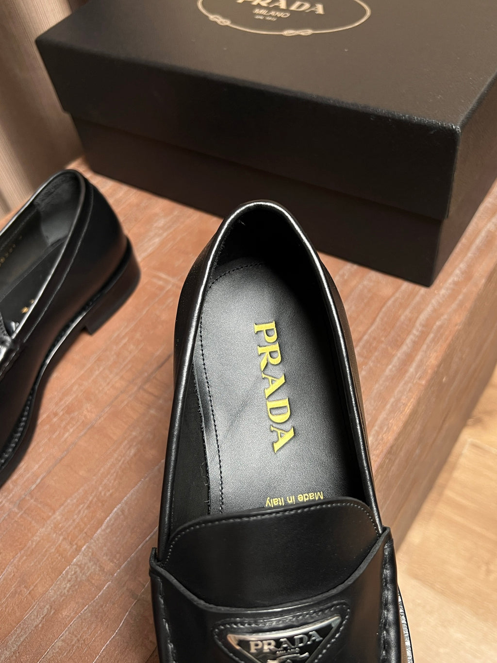 Prada unisex black leather loafer interior with PRADA insole branding