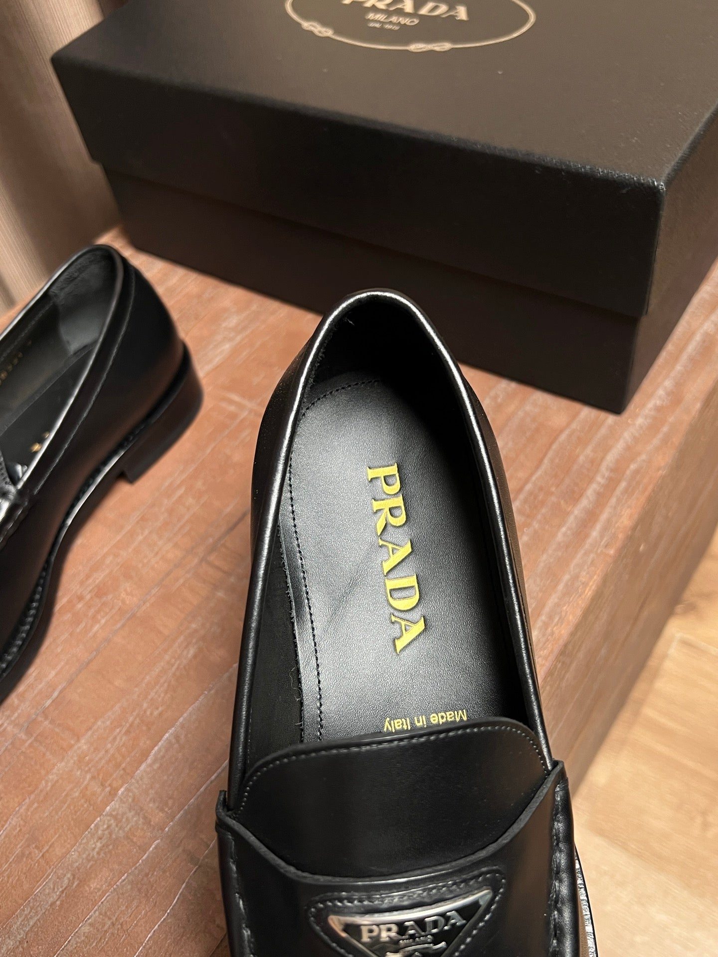 Prada unisex black leather loafer interior with PRADA insole branding