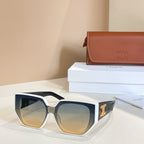 Black sunglasses with light gradient lenses and gold logo on the temple