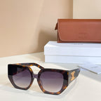 Tortoiseshell sunglasses with purple-tinted lenses and gold logo temple detail