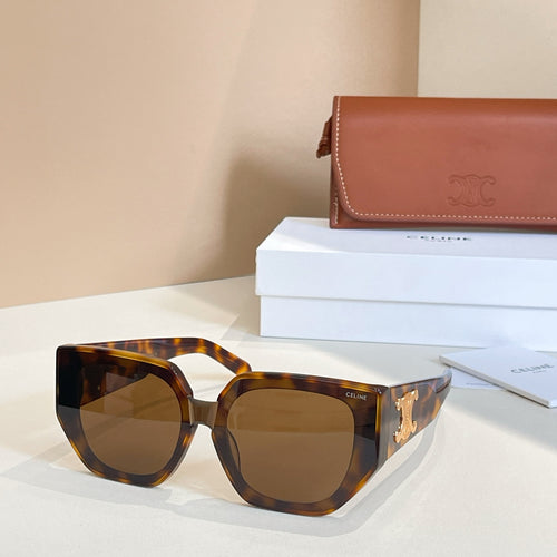 Tortoiseshell sunglasses with dark lenses and gold logo detail on the temple