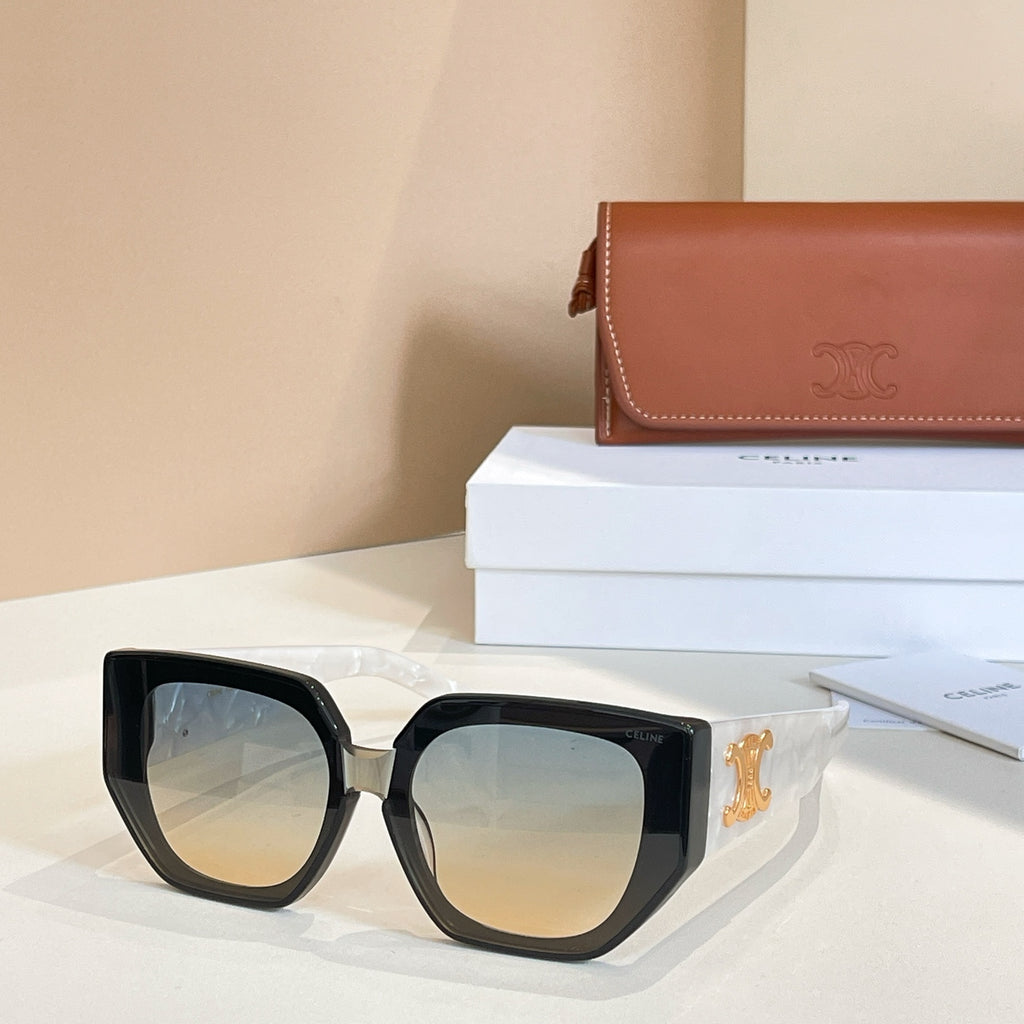 Black sunglasses with amber-tinted lenses and gold logo temple detail