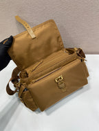 Prada tan mini bag with dual straps, front flap pocket, and gold-tone buckle