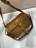 Prada small shoulder bag in tan with side pocket, flap front and gold buckle