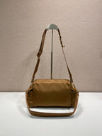 Prada shoulder bag in tan with long strap, flap front and gold hardware