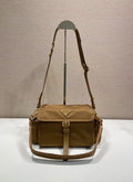 Prada crossbody bag in tan with flap, top handle strap and gold hardware