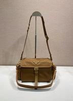 Prada crossbody bag in tan with flap, top handle strap and gold hardware