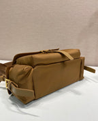 Prada tan bag with top zip, rolled handle detail, and gold-tone hardware