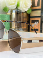Gucci sunglasses side view with dark lenses and metal frame
