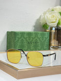 Gucci sunglasses with gold frame and yellow tinted lenses