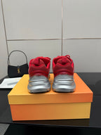 Red lace-up sneakers showing rear heels and lace-loop design