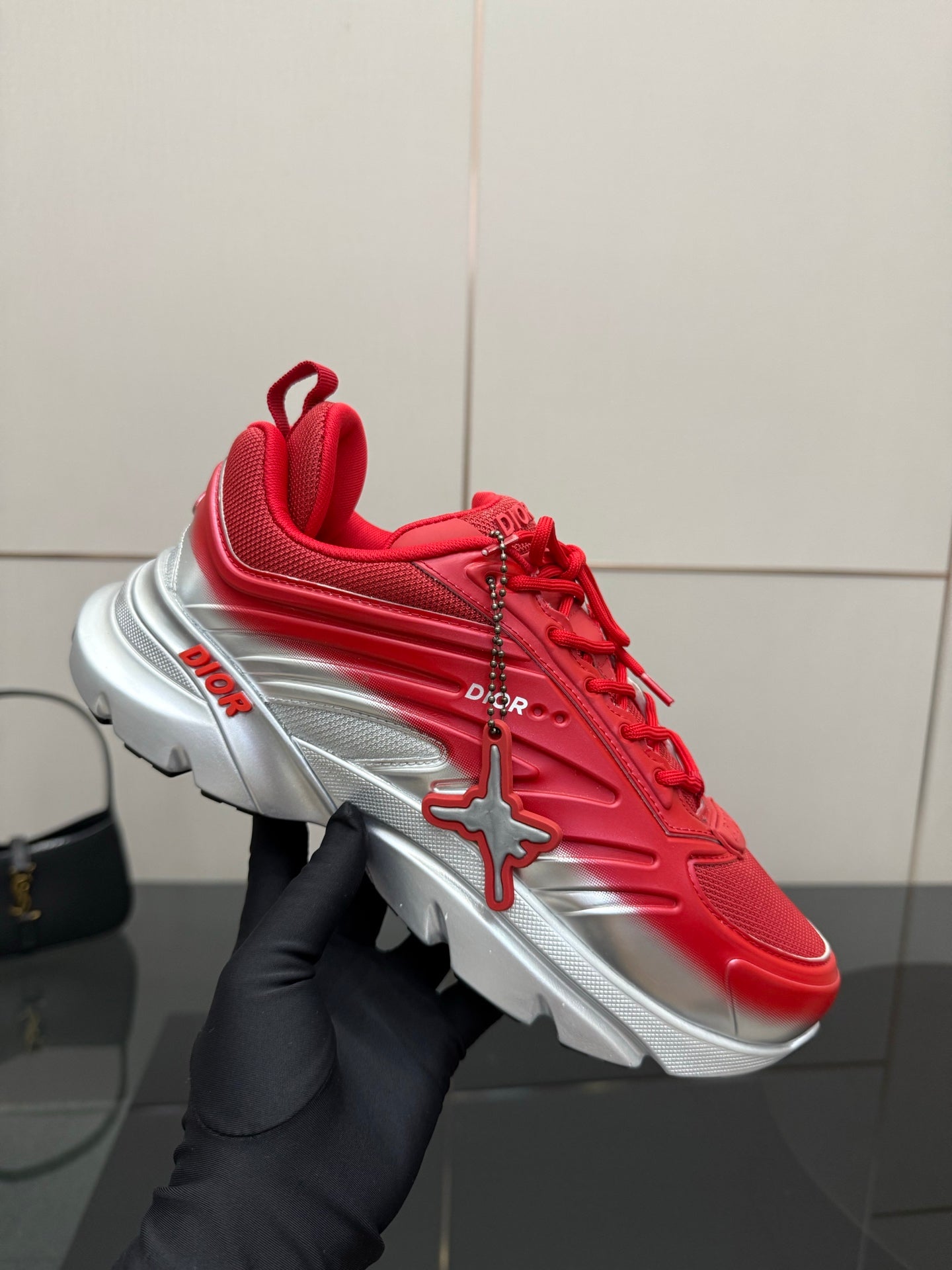 Red lace-up sneaker with silver sole and star-shaped side emblem