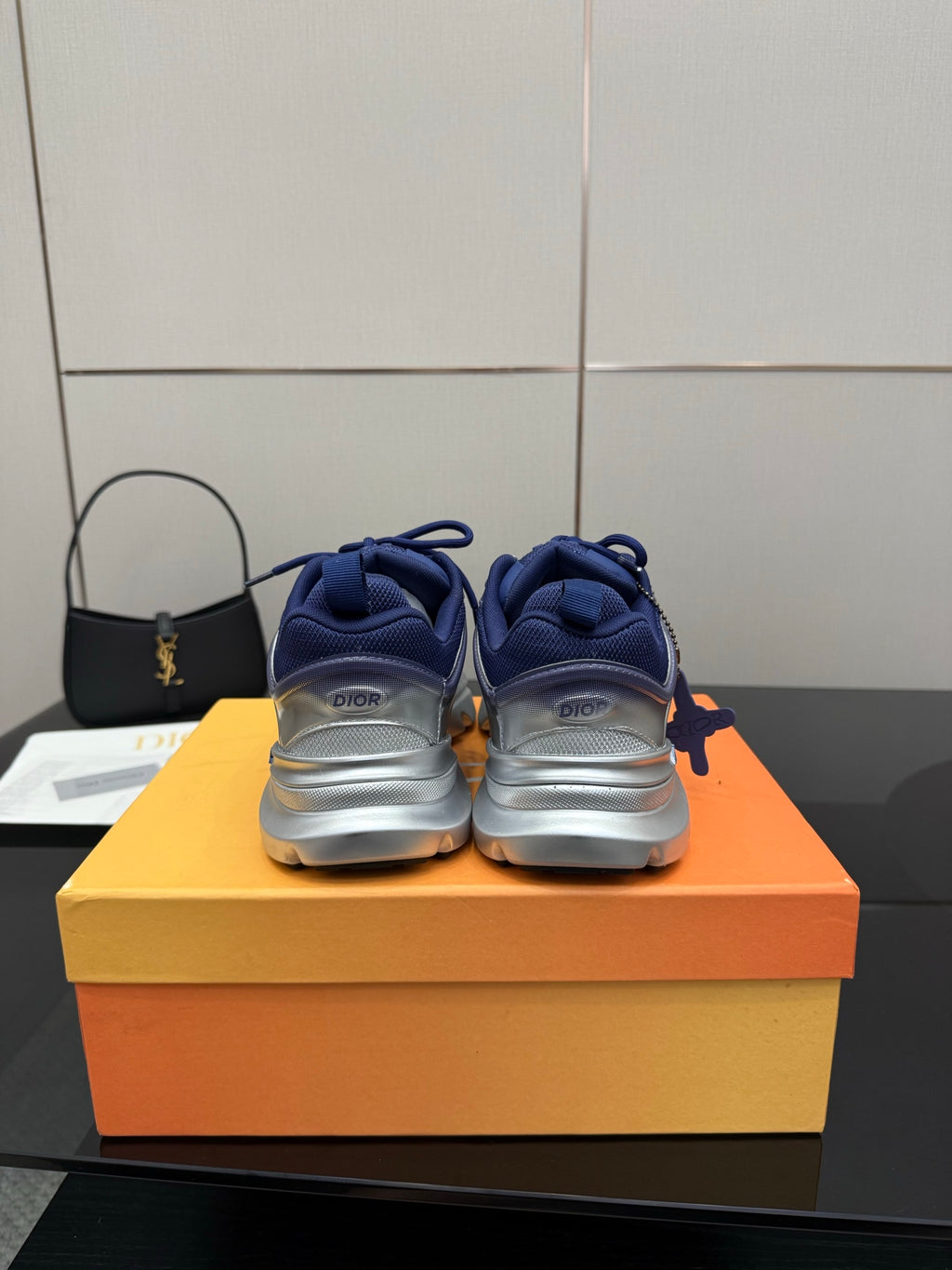Back view of blue lace-up sneakers with cushioned heel and padded collar