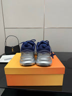 Back view of blue lace-up sneakers with cushioned heel and padded collar
