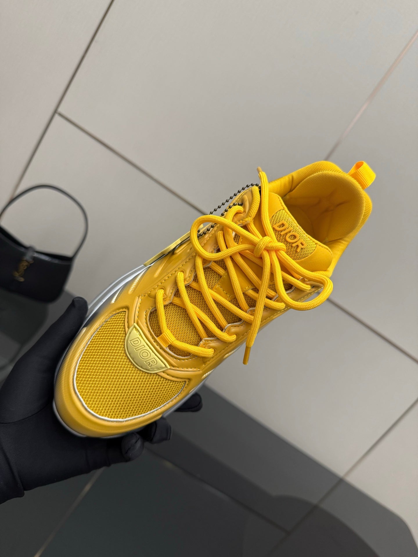 Women’s Dior lace-up sneaker, yellow upper with laces and textured toe panel
