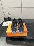 Ladies' Dior sneakers, black uppers with black laces and silver sole accents