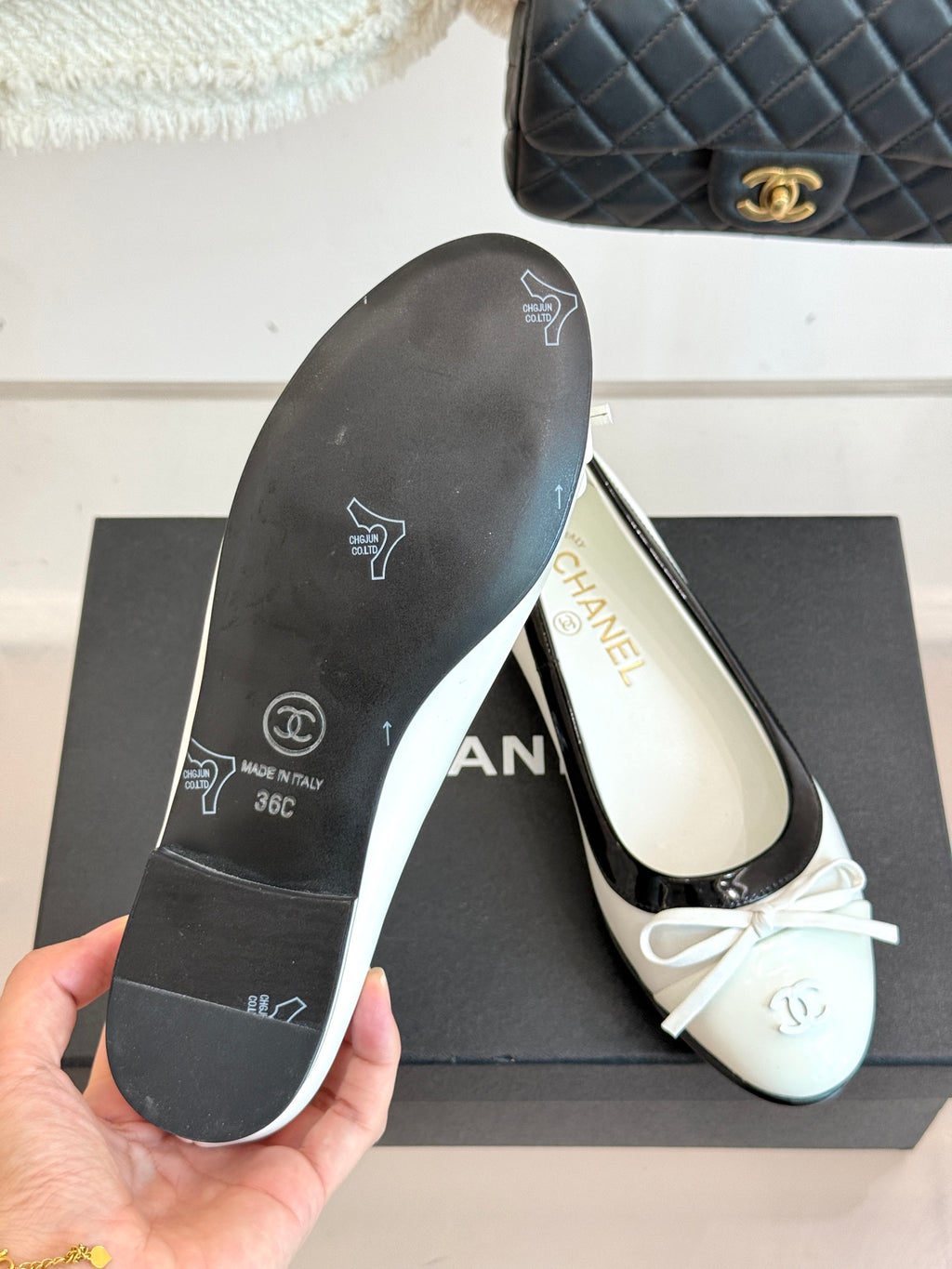 Ballet flats underside with textured rubber sole marked 'CHANEL'