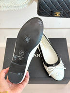 Ballet flats underside with textured rubber sole marked 'CHANEL'