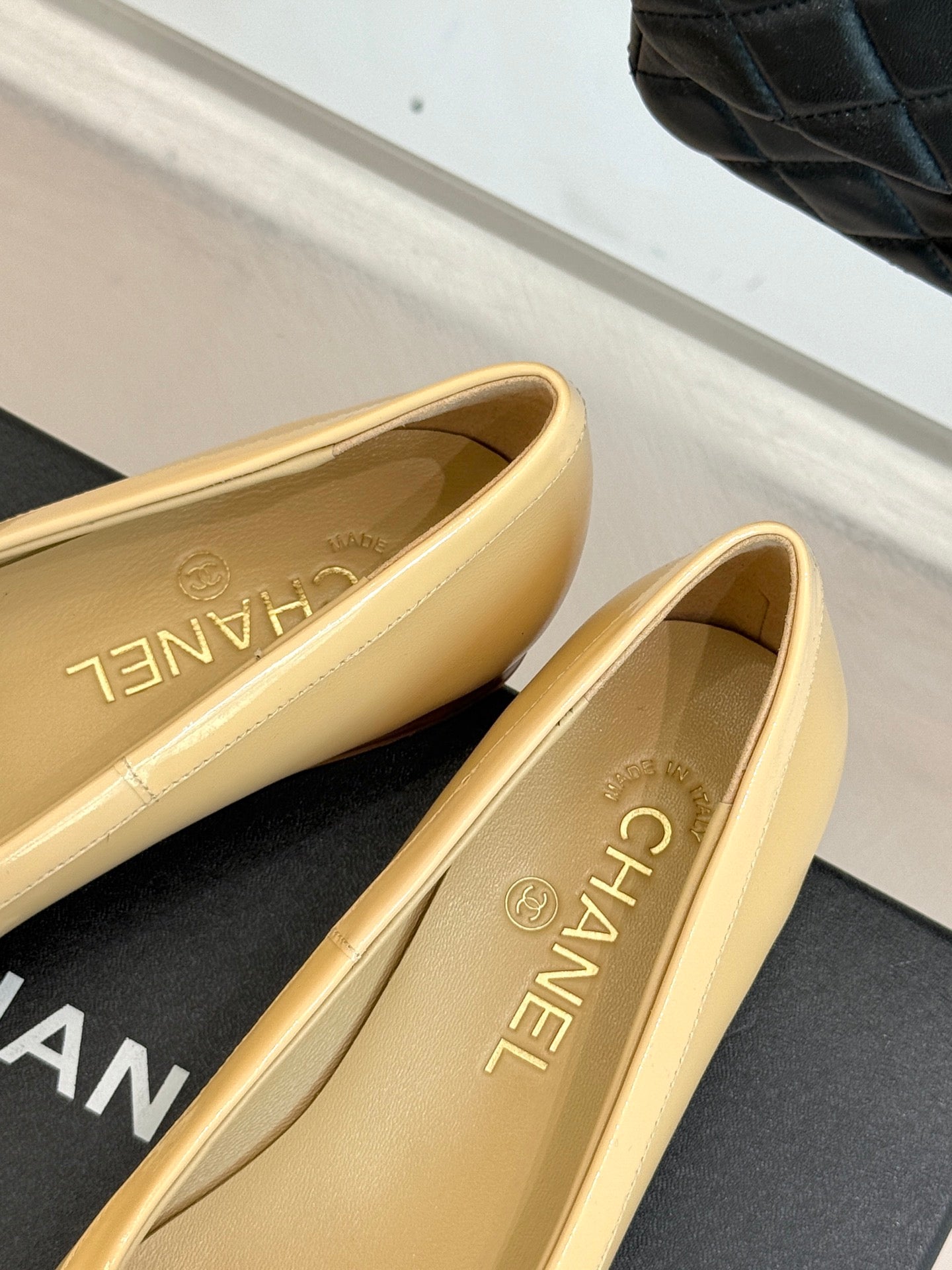 Beige patent ballet flats with CHANEL logo on insole and pointed toe