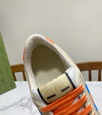 Gucci unisex sneaker insole/heel area, orange lace shoe with Gucci logo label