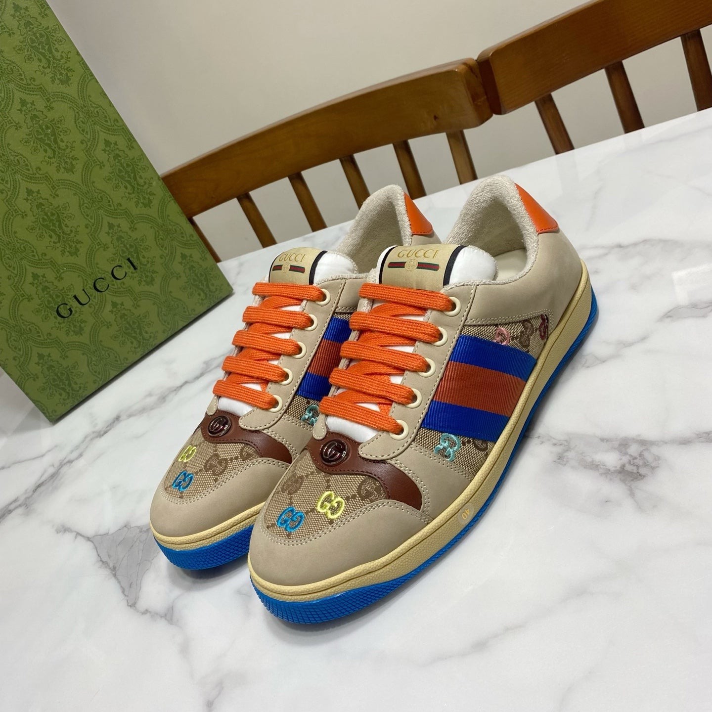 Gucci unisex low-top sneakers, beige canvas with orange laces and blue stripe detail