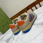 Gucci unisex low-top sneakers, heel and tongue view with orange accents and blue sole