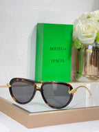 Bottega Veneta sunglasses with tortoiseshell frame and dark gray lenses