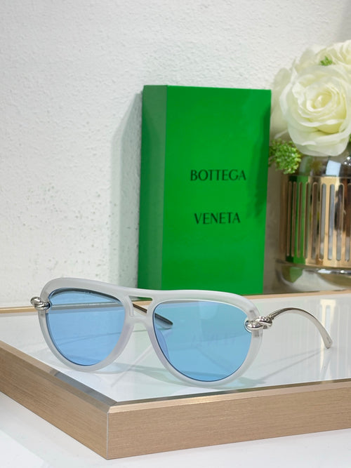 Bottega Veneta sunglasses with light blue frame and blue tinted lenses