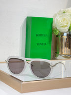 Bottega Veneta sunglasses with light gray frame and dark taupe lenses