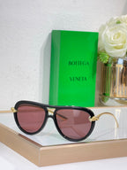 Bottega Veneta sunglasses with black frame and rose tinted lenses