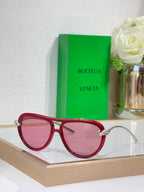 Bottega Veneta sunglasses with red frame and pink tinted lenses