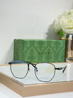 Gucci eyeglasses with dark rectangular frames and blue temple details