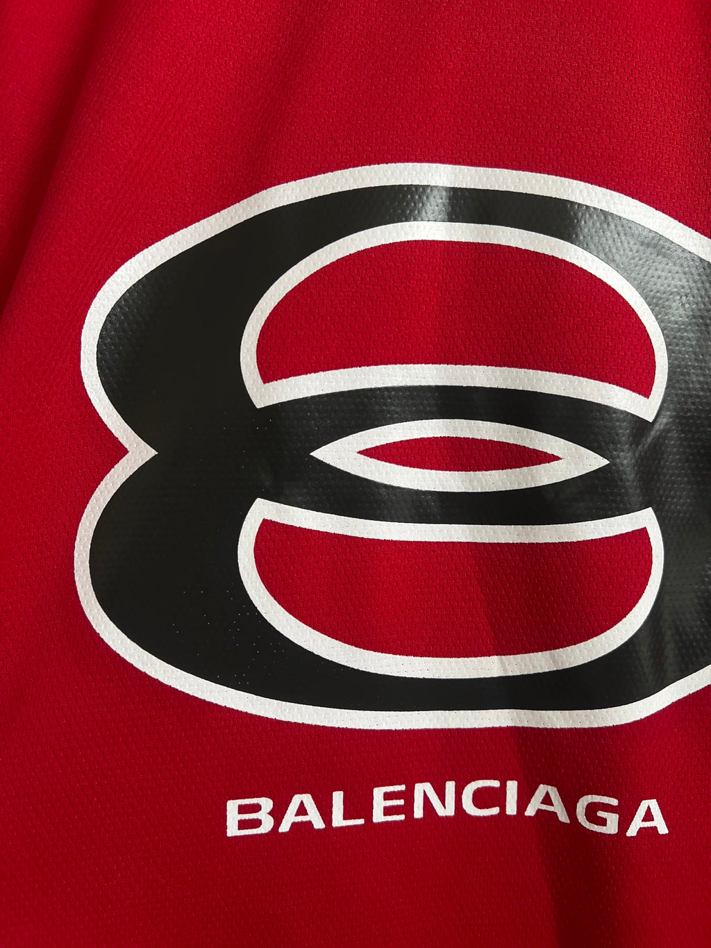 Red short-sleeve V-neck sweatshirt with large Balenciaga logo print