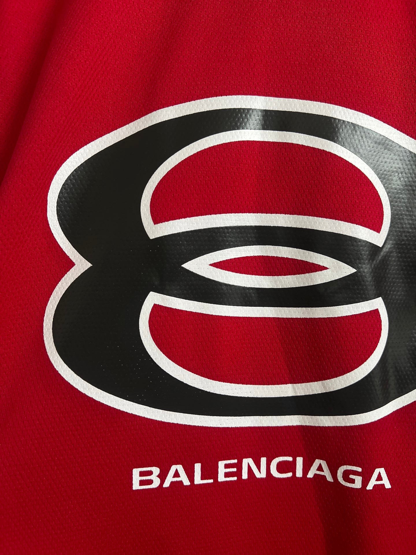 Red short-sleeve V-neck sweatshirt with large Balenciaga logo print