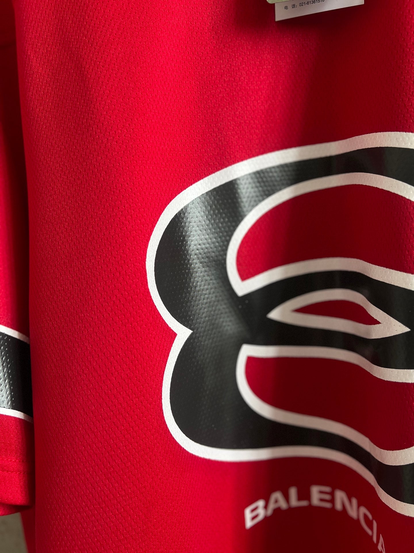 Red short-sleeve sweatshirt with large black-and-white Balenciaga logo detail