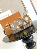 Designer shoulder bag with gray monogram canvas, gold chain strap, flap and clasp.