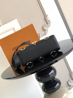 Louis Vuitton monogram mini bag with strap, black with tan logo print and gold studs