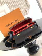 Louis Vuitton monogram mini bag open showing red interior, gold hardware on black