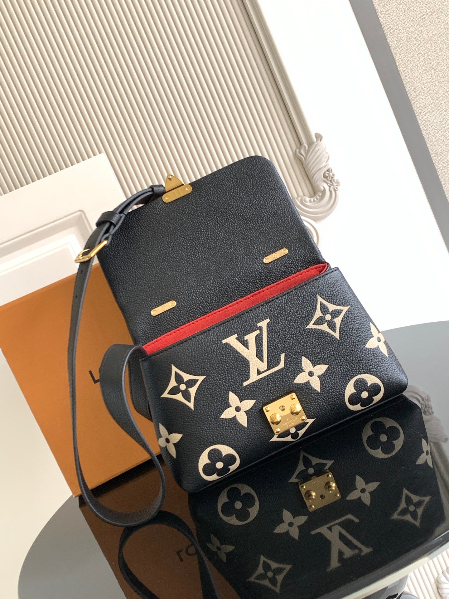Louis Vuitton monogram mini bag with strap, black with tan pattern and gold accents