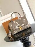 Beige Louis Vuitton top-handle bag with monogram pattern and gold hardware