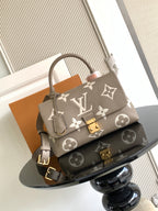 Beige Louis Vuitton top-handle bag with monogram pattern and gold hardware