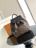 Louis Vuitton monogram bag with black top handle and front lock details