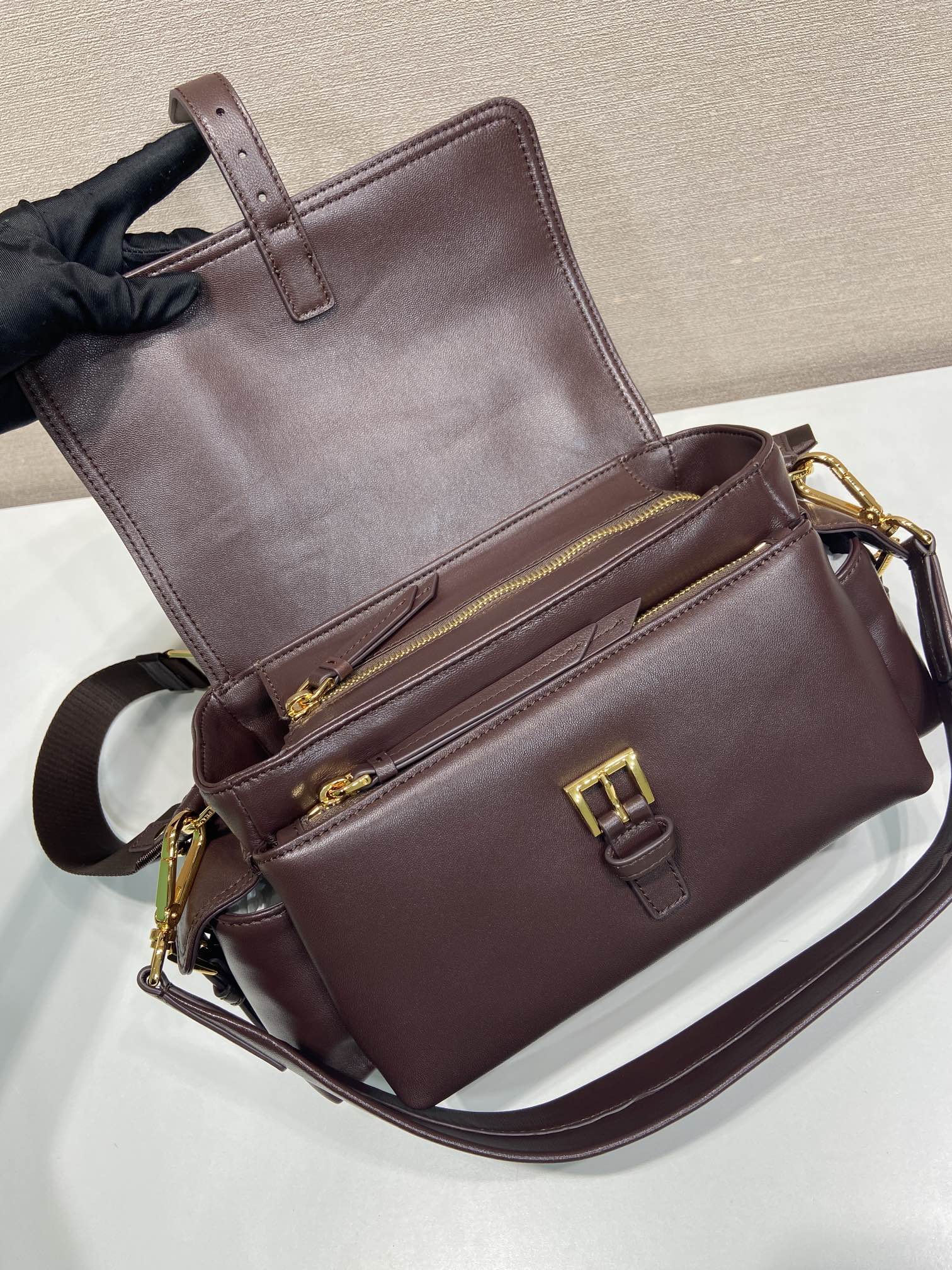 Prada leather mini bag with double compartments and zip, dark brown.