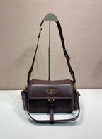 Prada leather shoulder bag with flap and gold-tone hardware, dark brown.