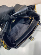 Prada black leather bag interior with zip closure and textured lining.