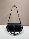 Prada black leather shoulder bag with flap, gold hardware, and adjustable strap.